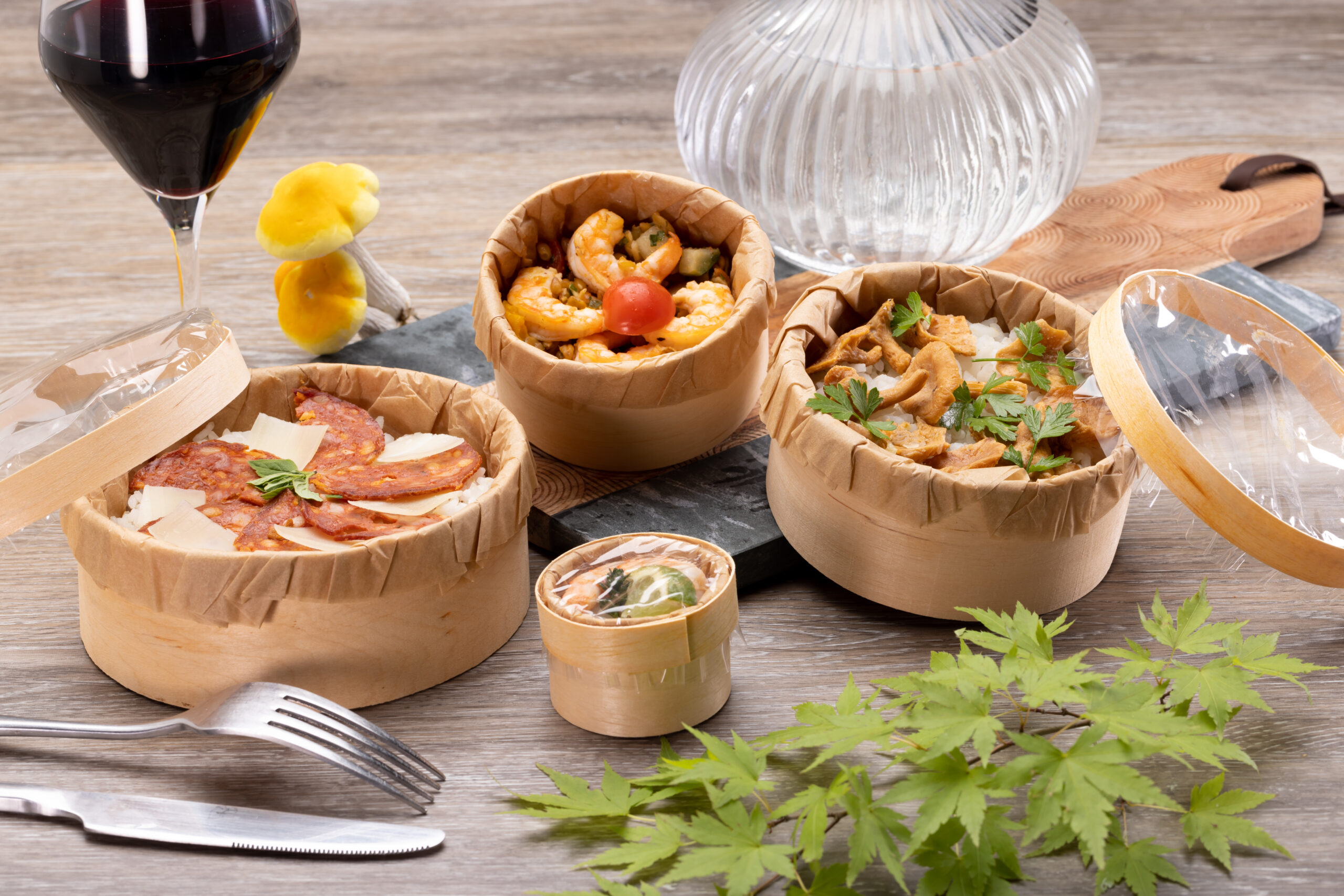 Food inside a wooden box with a transparent lid